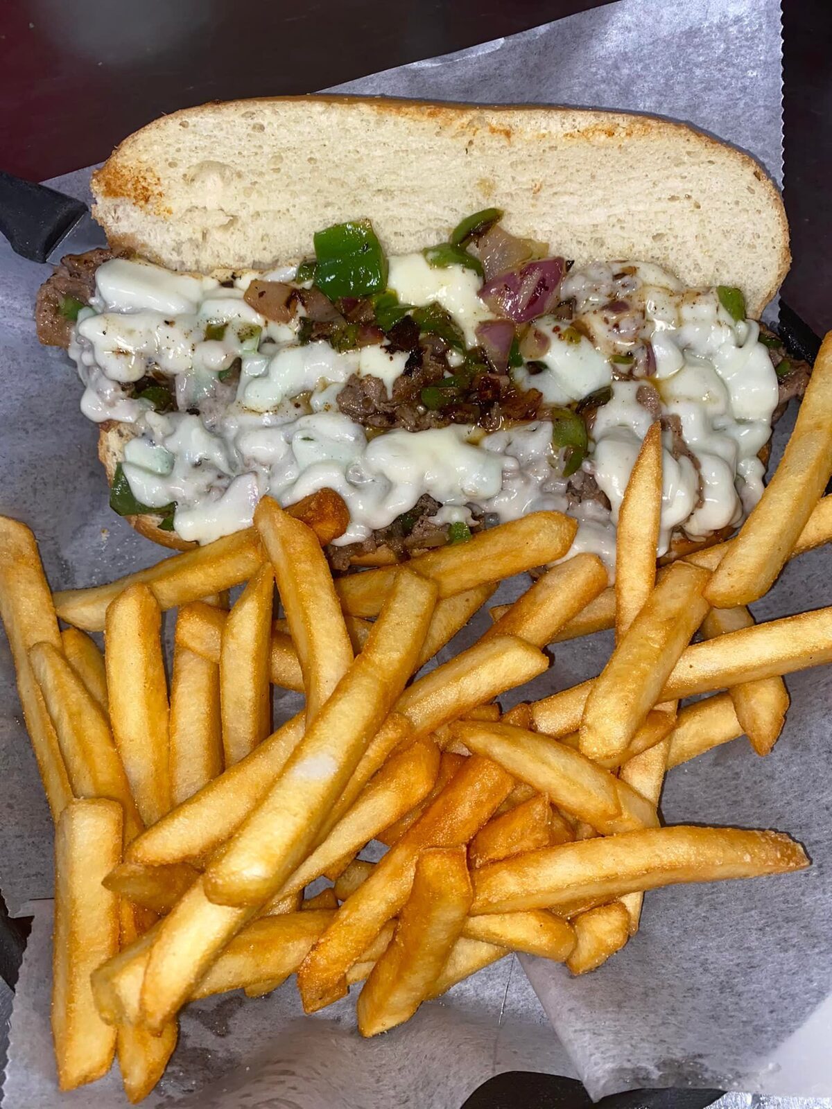 A grilled melt with fries